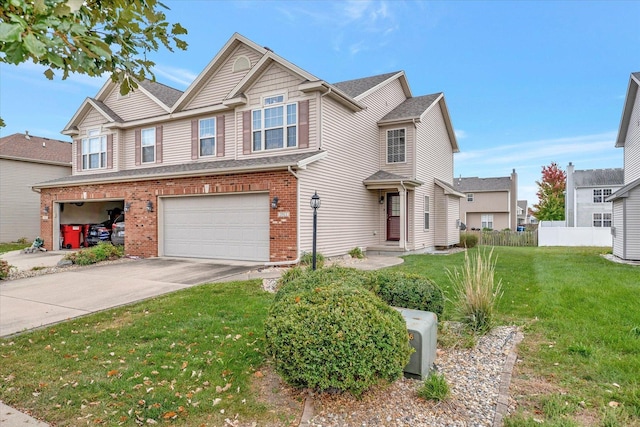 3911 Summer Sage Ct, Champaign, IL 61822 - view of front facade with brick siding, an attached garage, and driveway