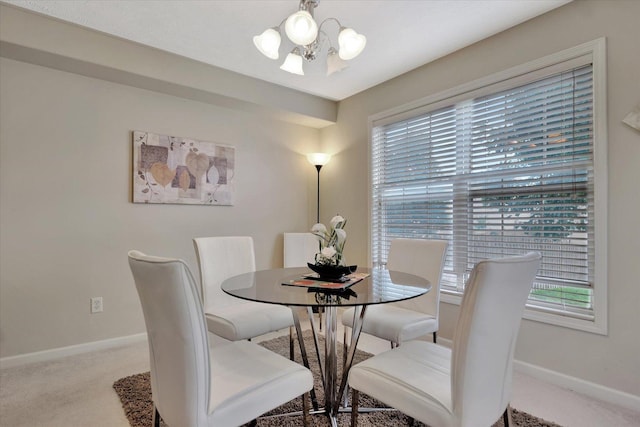 3911 Summer Sage Ct, Champaign, IL 61822 - carpeted dining space featuring a chandelier and baseboards