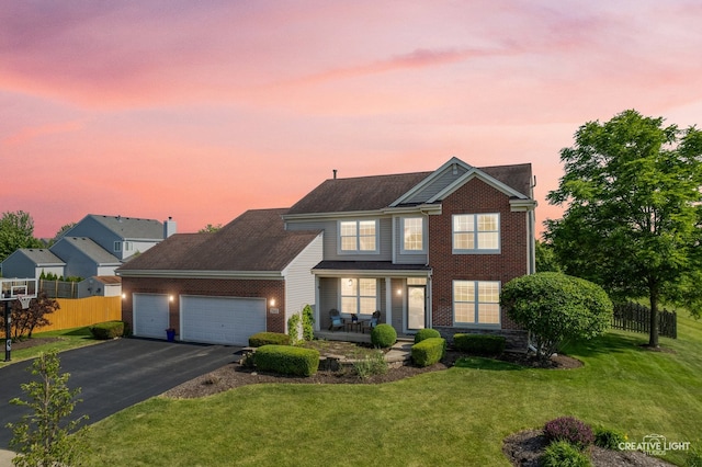 25411 W Juniper Ct, Plainfield, IL 60585 - traditional-style home featuring asphalt driveway, a porch, an attached garage, and brick siding