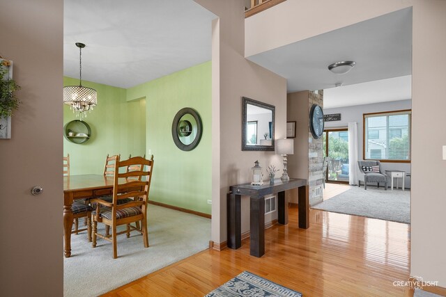 25411 W Juniper Ct, Plainfield, IL 60585 - carpeted dining area with wood finished floors and a chandelier
