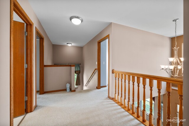 25411 W Juniper Ct, Plainfield, IL 60585 - hall with an upstairs landing, a chandelier, and carpet
