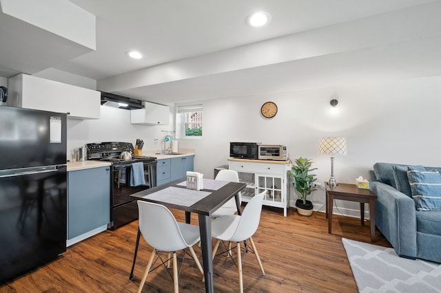 318 Custer Ave, Evanston, IL 60202 - dining area with dark wood-type flooring and recessed lighting