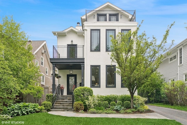 567 Provident Ave, Winnetka, IL 60093 - view of front of home with a balcony and stucco siding