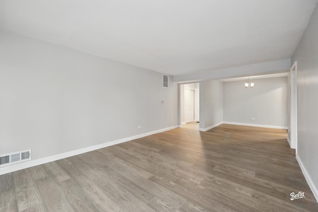 5500 Carriageway Dr Unit 213, Rolling Meadows, IL 60008 - empty room with a chandelier, wood finished floors, and baseboards