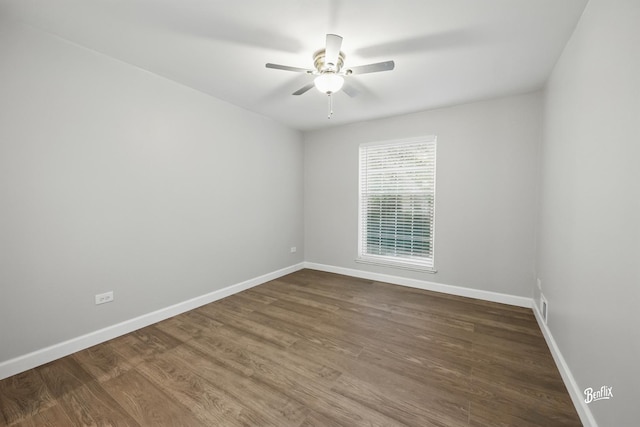 5500 Carriageway Dr Unit 213, Rolling Meadows, IL 60008 - spare room with baseboards, ceiling fan, and dark wood-style flooring