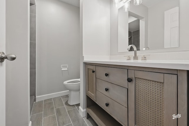 5500 Carriageway Dr Unit 213, Rolling Meadows, IL 60008 - bathroom with toilet, vanity, baseboards, and a shower