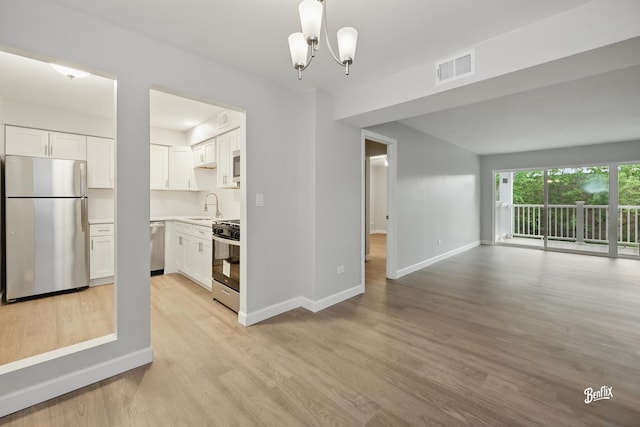 5500 Carriageway Dr Unit 213, Rolling Meadows, IL 60008 - interior space featuring baseboards, a sink, light wood-type flooring, and a chandelier