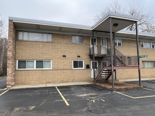 7 Garden Dr Unit 7, La Grange Park, IL 60526 - view of building exterior featuring uncovered parking and stairs