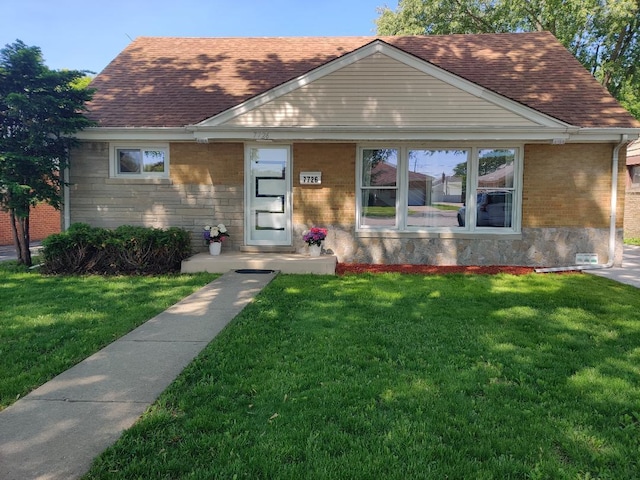 7726 N Harlem Ave, Niles, IL 60714 - view of front of house featuring a front lawn, roof with shingles, and brick siding