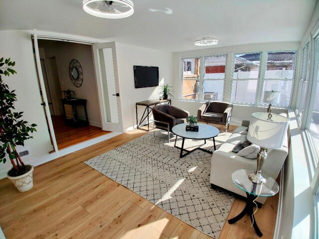 7726 N Harlem Ave, Niles, IL 60714 - living area featuring wood finished floors and baseboards