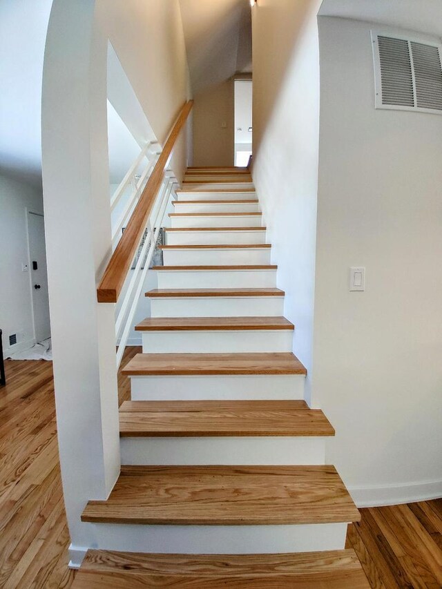 7726 N Harlem Ave, Niles, IL 60714 - stairs featuring wood finished floors and arched walkways