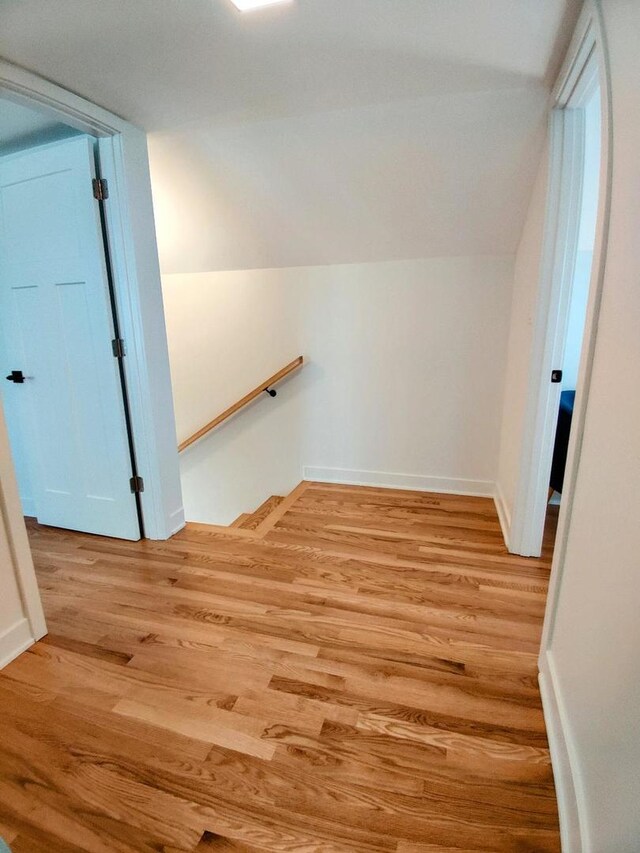 7726 N Harlem Ave, Niles, IL 60714 - additional living space featuring light wood-style flooring, lofted ceiling, and baseboards