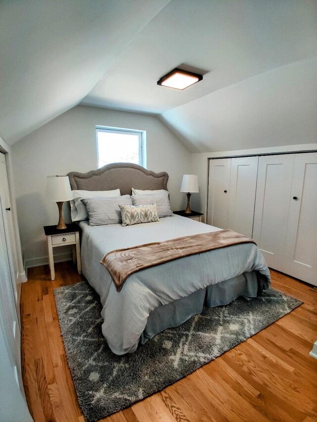 7726 N Harlem Ave, Niles, IL 60714 - bedroom featuring lofted ceiling, light wood-style floors, and a closet