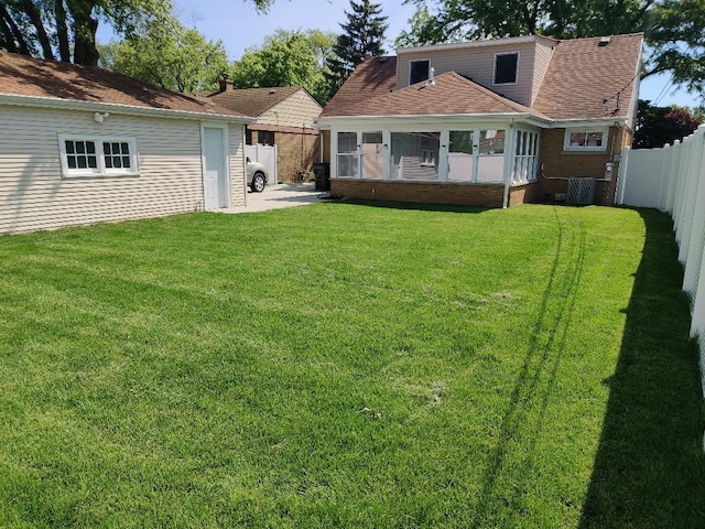 7726 N Harlem Ave, Niles, IL 60714 - back of house featuring a sunroom and central AC unit