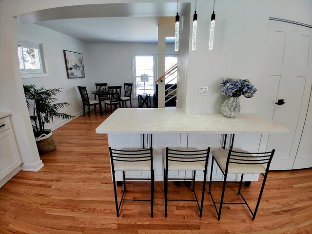 7726 N Harlem Ave, Niles, IL 60714 - dining space featuring plenty of natural light, light wood finished floors, and baseboards