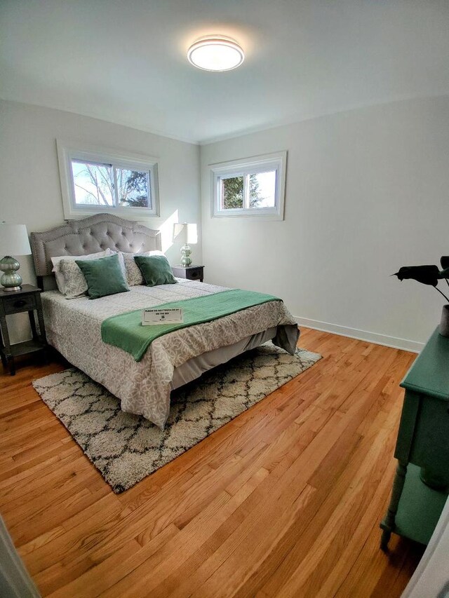 7726 N Harlem Ave, Niles, IL 60714 - bedroom featuring light wood-style floors and baseboards