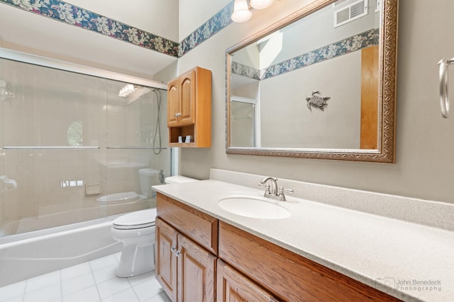 1514 Triple Crown Ct, Saint Charles, IL 60174 - bathroom featuring toilet, vanity, tile patterned flooring, and enclosed tub / shower combo