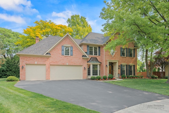 1514 Triple Crown Ct, Saint Charles, IL 60174 - view of front of house featuring driveway, brick siding, a chimney, and an attached garage