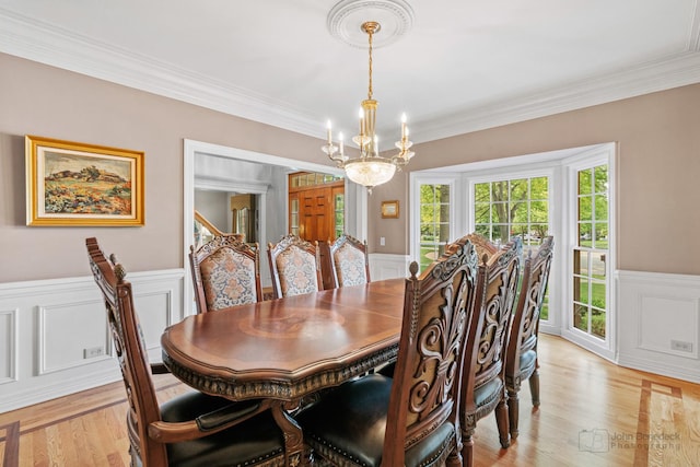 1514 Triple Crown Ct, Saint Charles, IL 60174 - dining room featuring a chandelier, wainscoting, a decorative wall, light wood-style floors, and crown molding