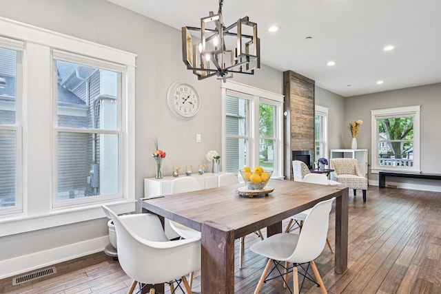 93 Liberty St, West Dundee, IL 60118 - dining area featuring hardwood / wood-style floors, baseboards, a chandelier, recessed lighting, and a large fireplace