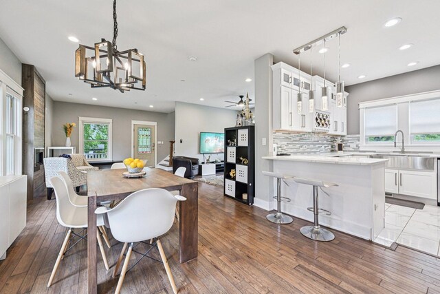 93 Liberty St, West Dundee, IL 60118 - dining space with a chandelier, dark wood-type flooring, recessed lighting, and a ceiling fan