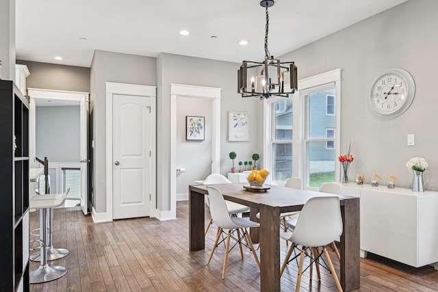 93 Liberty St, West Dundee, IL 60118 - dining room featuring a chandelier, wood-type flooring, recessed lighting, and baseboards