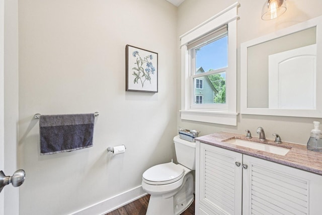 93 Liberty St, West Dundee, IL 60118 - bathroom with toilet, baseboards, wood finished floors, and vanity