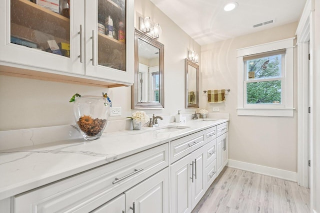 93 Liberty St, West Dundee, IL 60118 - full bath featuring double vanity, baseboards, wood finished floors, and recessed lighting