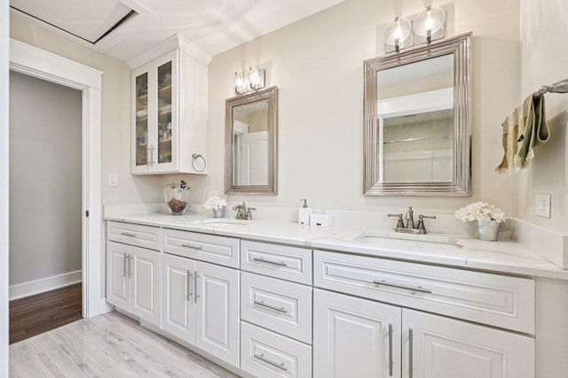 93 Liberty St, West Dundee, IL 60118 - full bathroom featuring double vanity, wood finished floors, and baseboards