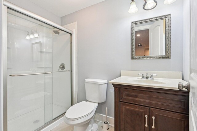93 Liberty St, West Dundee, IL 60118 - bathroom with vanity, a stall shower, toilet, and baseboards