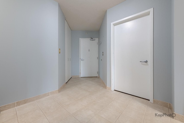 222 N Columbus Dr Unit 2808, Chicago, IL 60601 - hall with light tile patterned flooring and a textured ceiling