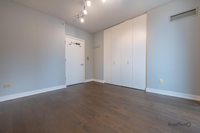 222 N Columbus Dr Unit 2808, Chicago, IL 60601 - unfurnished bedroom featuring dark wood-style floors and baseboards