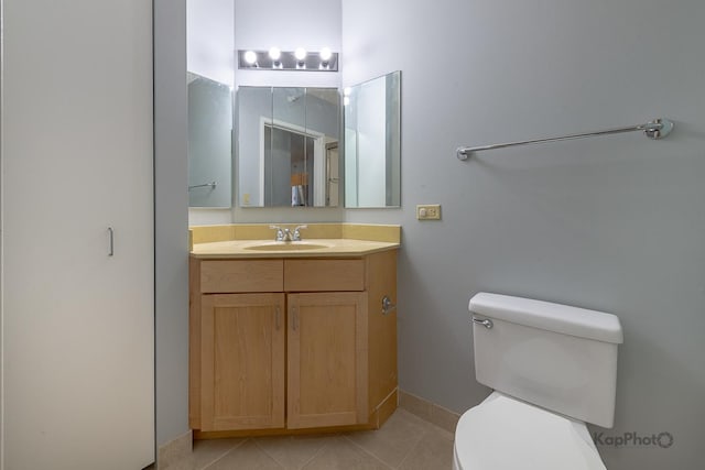 222 N Columbus Dr Unit 2808, Chicago, IL 60601 - bathroom featuring toilet, vanity, tile patterned flooring, and baseboards