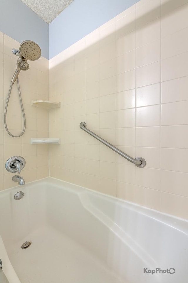 222 N Columbus Dr Unit 2808, Chicago, IL 60601 - full bathroom featuring washtub / shower combination and a textured ceiling