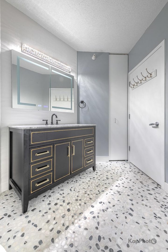 222 N Columbus Dr Unit 2808, Chicago, IL 60601 - bathroom featuring vanity and a textured ceiling