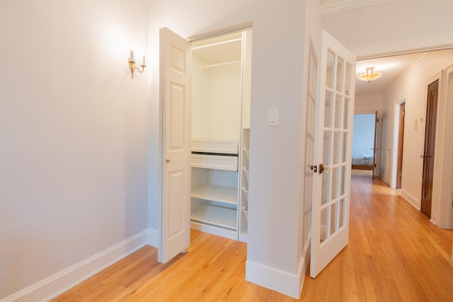 6652 N Glenwood Ave Unit 3N, Chicago, IL 60626 - hallway featuring light wood-style flooring, baseboards, and french doors