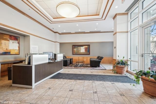 1640 Maple Ave Unit 505, Evanston, IL 60201 - reception featuring ornamental molding, a towering ceiling, and recessed lighting