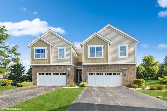 14 E Moseley Rd, Palatine, IL 60074 - view of front of home with asphalt driveway, an attached garage, brick siding, and a front yard
