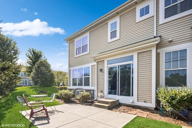 14 E Moseley Rd, Palatine, IL 60074 - rear view of property with a patio area and a lawn