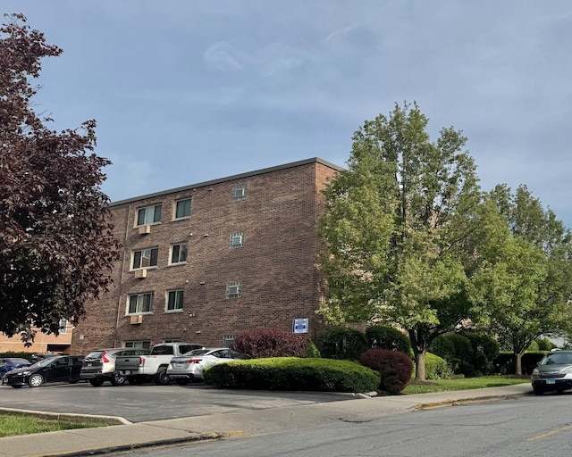 477 Graceland Ave Unit 2F, Des Plaines, IL 60016 - view of building exterior with uncovered parking