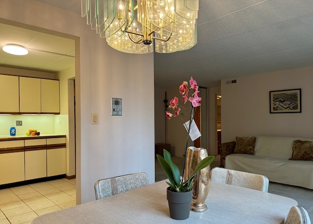 477 Graceland Ave Unit 2F, Des Plaines, IL 60016 - dining space with a chandelier and light tile patterned floors