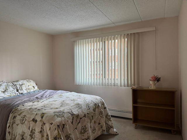 477 Graceland Ave Unit 2F, Des Plaines, IL 60016 - carpeted bedroom featuring a baseboard radiator