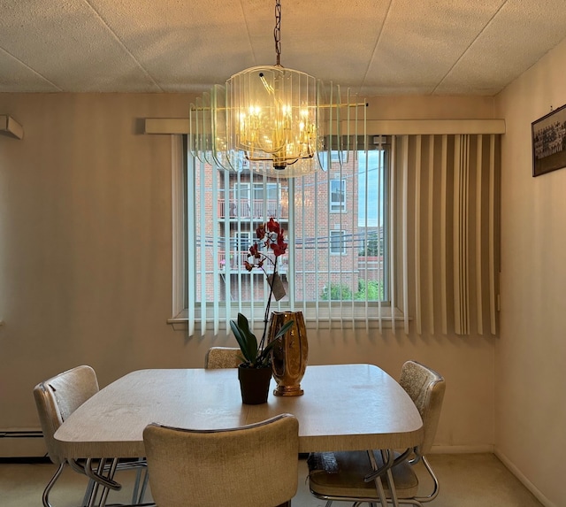477 Graceland Ave Unit 2F, Des Plaines, IL 60016 - carpeted dining space featuring a chandelier and a baseboard radiator