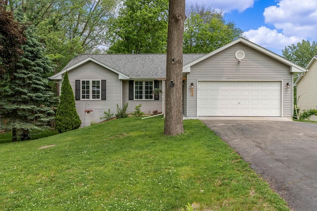 694 Lake Summerset Rd, Davis, IL 61019 - single story home with asphalt driveway, a garage, a front yard, and a shingled roof