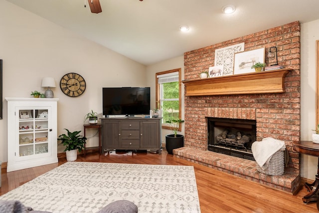 694 Lake Summerset Rd, Davis, IL 61019 - living room with vaulted ceiling, wood finished floors, ceiling fan, a brick fireplace, and recessed lighting