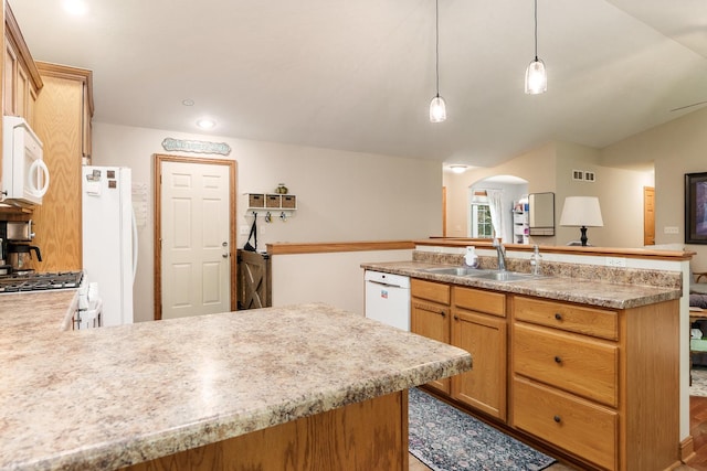 694 Lake Summerset Rd, Davis, IL 61019 - kitchen featuring white appliances, a sink, arched walkways, light countertops, and vaulted ceiling