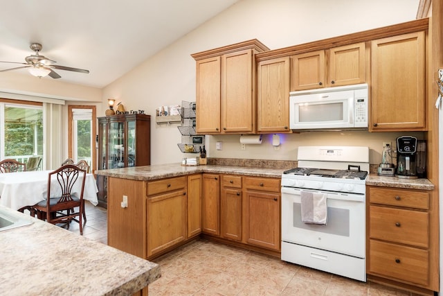 694 Lake Summerset Rd, Davis, IL 61019 - kitchen featuring white appliances, vaulted ceiling, ceiling fan, a peninsula, and light tile patterned floors