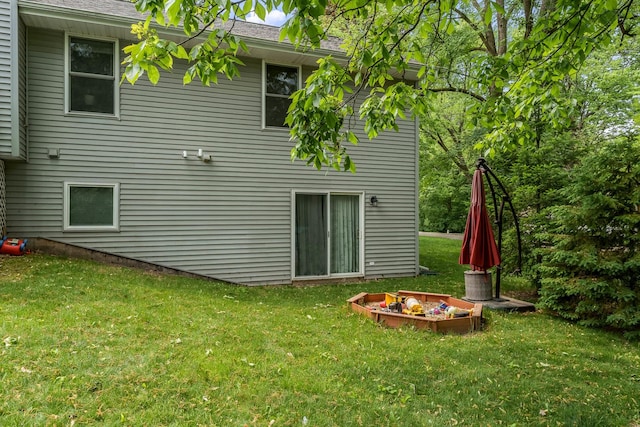 694 Lake Summerset Rd, Davis, IL 61019 - back of house with a yard and an outdoor fire pit