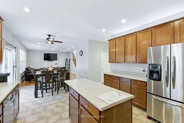 16347 W Cagwin Dr, Lockport, IL 60441 - kitchen with stainless steel appliances, ceiling fan, light countertops, a center island, and open floor plan
