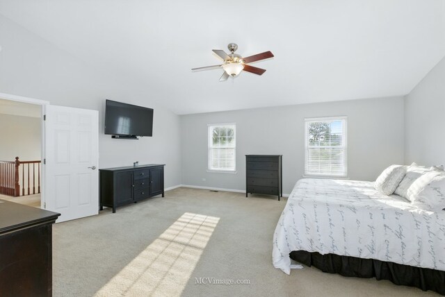 16347 W Cagwin Dr, Lockport, IL 60441 - bedroom with light colored carpet, vaulted ceiling, and ceiling fan
